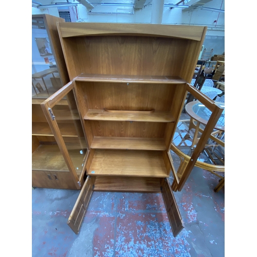 173 - A mid 20th century Nathan teak display cabinet/wall unit - approx. 194cm high x 102cm wide x 46cm de... 