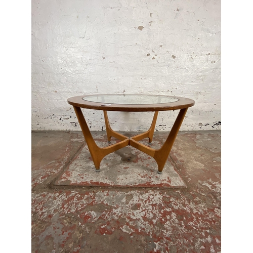 174 - A mid 20th century G Plan style teak and beech circular coffee table with glass top - approx. 44cm h... 