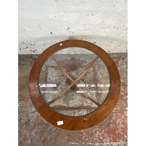 174 - A mid 20th century G Plan style teak and beech circular coffee table with glass top - approx. 44cm h... 