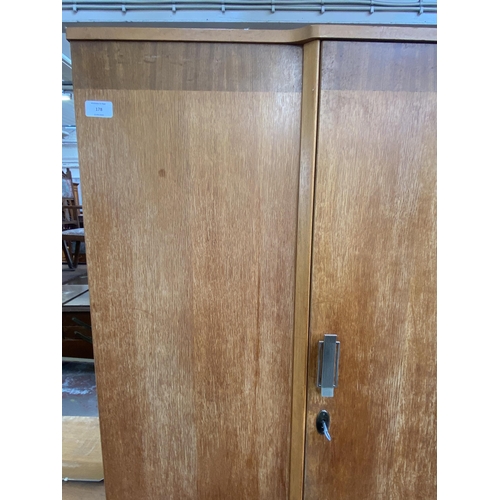 178 - A mid 20th century oak single wardrobe - approx. 179cm high x 118cm wide x 46cm deep