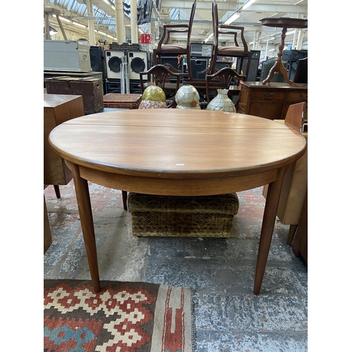 182 - A mid 20th century G Plan Fresco teak circular extending dining table - approx. 73cm high x 123cm di... 