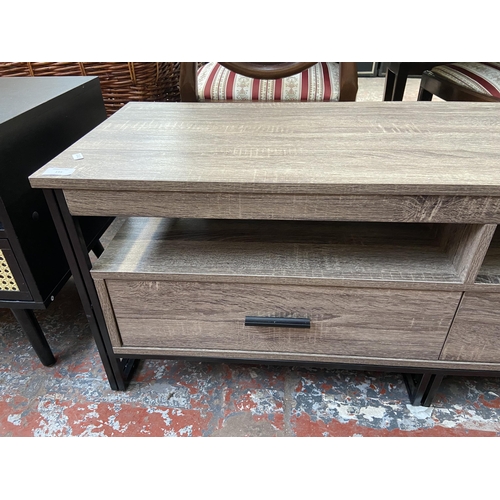 195 - A Vonhaus dark wood effect and black metal two drawer TV stand - approx. 45cm high x 120cm wide x 40... 