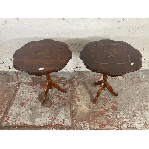 198 - A pair of Italian style inlaid walnut effect serpentine tripod occasional tables - approx. 60cm high... 