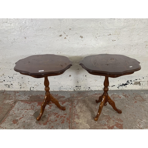 198 - A pair of Italian style inlaid walnut effect serpentine tripod occasional tables - approx. 60cm high... 