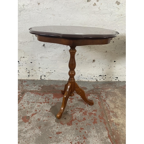 198 - A pair of Italian style inlaid walnut effect serpentine tripod occasional tables - approx. 60cm high... 