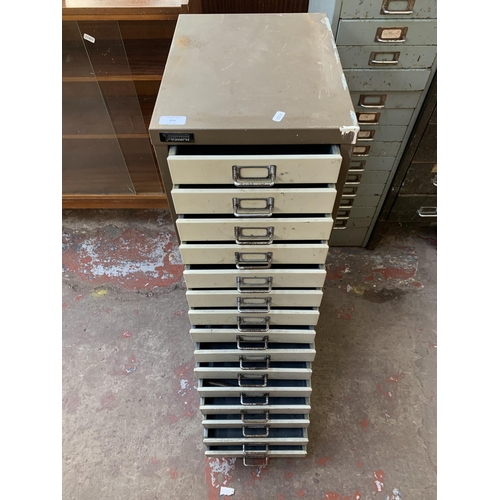 202 - A Triumph brown and cream metal fifteen drawer office filing cabinet - approx. 85cm high x 31cm wide... 