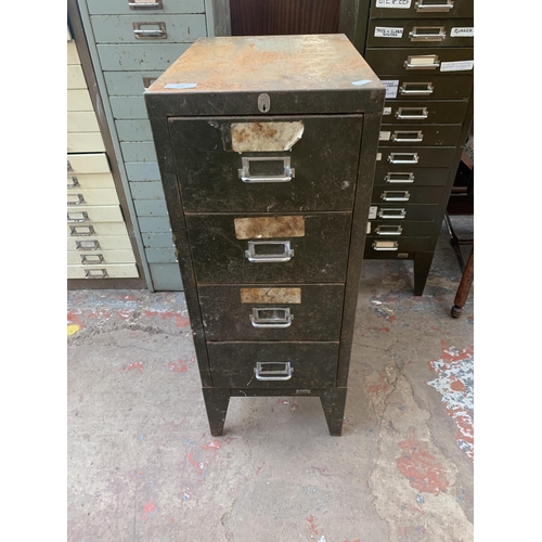 204 - A Stor military green metal four drawer office filing cabinet - approx. 73cm high x 29cm wide x 42cm... 