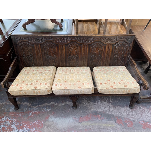 207 - An 18th century carved oak settle - approx. 81cm high x 183cm wide x 73cm deep