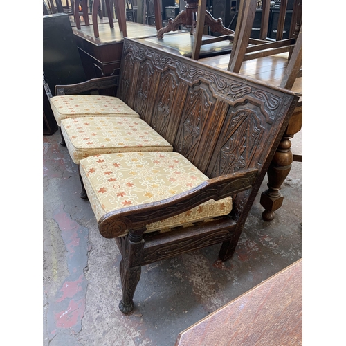 207 - An 18th century carved oak settle - approx. 81cm high x 183cm wide x 73cm deep