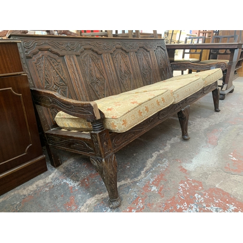 207 - An 18th century carved oak settle - approx. 81cm high x 183cm wide x 73cm deep