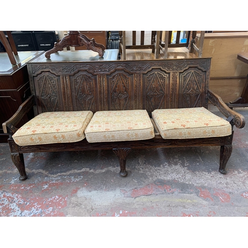 207 - An 18th century carved oak settle - approx. 81cm high x 183cm wide x 73cm deep