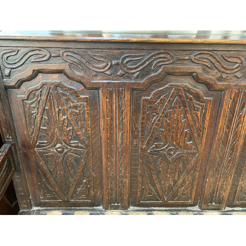 207 - An 18th century carved oak settle - approx. 81cm high x 183cm wide x 73cm deep