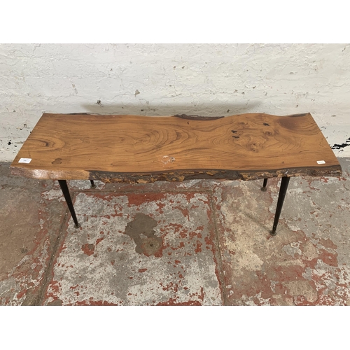 209 - A mid 20th century elm tree slice coffee table on dansette supports - approx. 48cm high x 46cm wide ... 