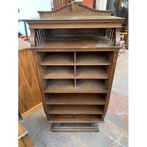 211 - A late Victorian oak shelving unit - approx. 152cm high x 74cm wide x 42cm deep