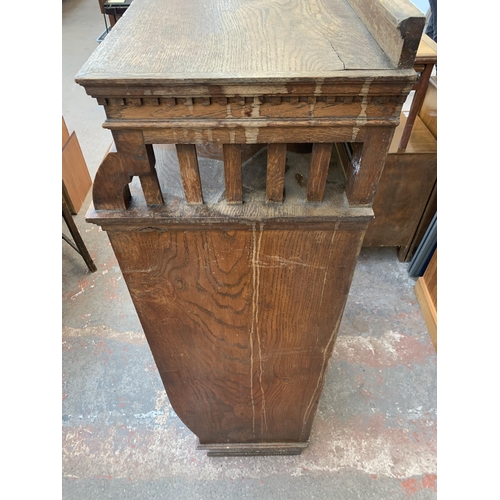 211 - A late Victorian oak shelving unit - approx. 152cm high x 74cm wide x 42cm deep