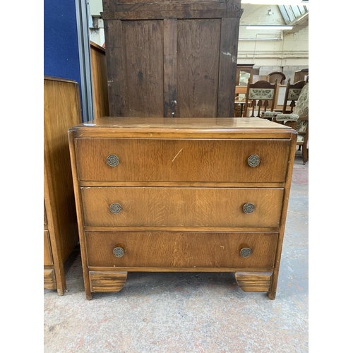 214 - An early/mid 20th century oak chest of drawers - approx. 69cm high x 76cm wide x 42cm deep