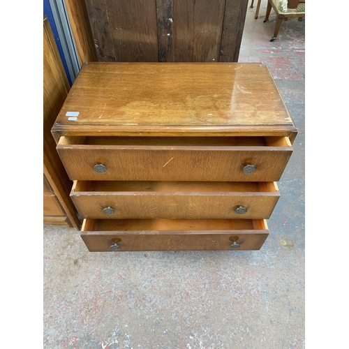 214 - An early/mid 20th century oak chest of drawers - approx. 69cm high x 76cm wide x 42cm deep