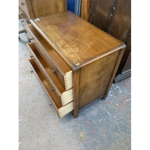 214 - An early/mid 20th century oak chest of drawers - approx. 69cm high x 76cm wide x 42cm deep