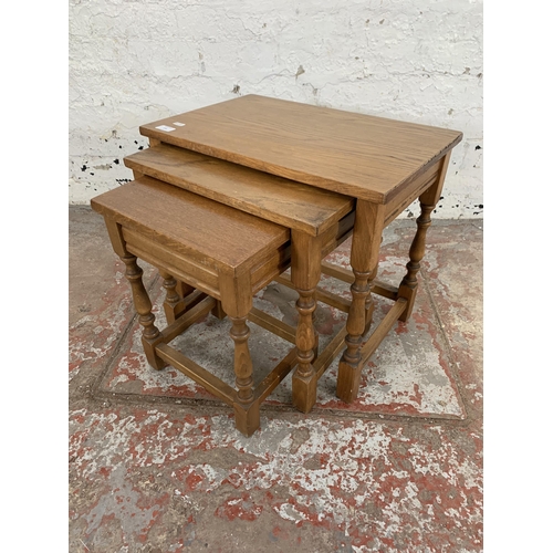 216 - An oak nest of tables - approx. 45cm high x 51cm wide x 34cm deep