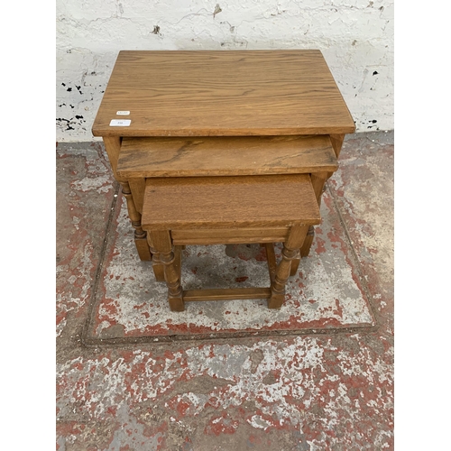 216 - An oak nest of tables - approx. 45cm high x 51cm wide x 34cm deep