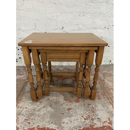 216 - An oak nest of tables - approx. 45cm high x 51cm wide x 34cm deep