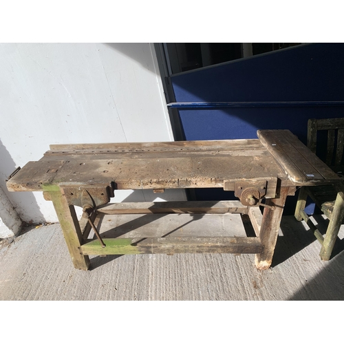 218 - An early 20th century pine work bench with three fitted vices - approx. 82cm high x 198cm wide x 60c... 