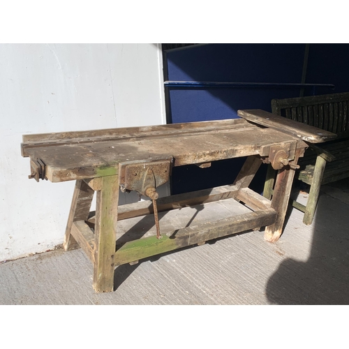 218 - An early 20th century pine work bench with three fitted vices - approx. 82cm high x 198cm wide x 60c... 