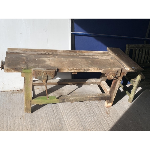 218 - An early 20th century pine work bench with three fitted vices - approx. 82cm high x 198cm wide x 60c... 