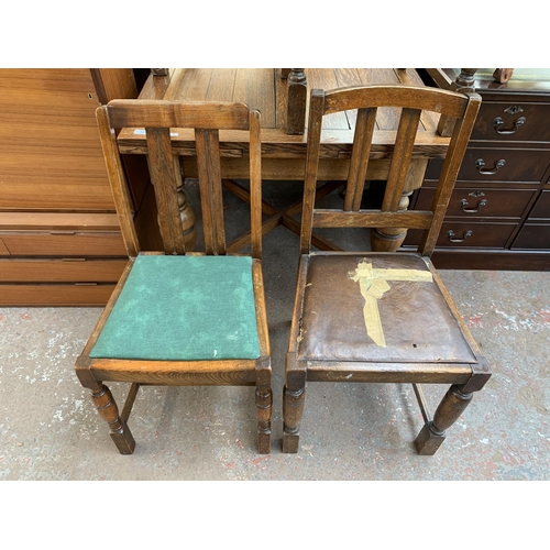 223 - A 1930s oak draw leaf dining table and four chairs - table approx. 75cm high x 91cm wide x 87cm long... 