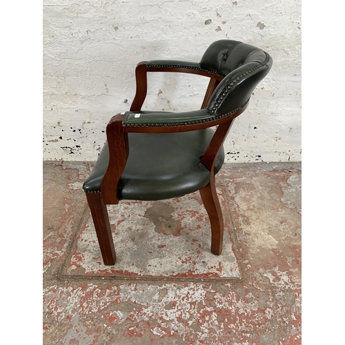 226 - A mahogany and green leather desk chair - approx. 76cm high x 60cm wide x 50cm deep