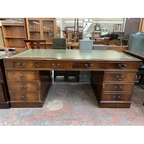 228 - A 19th century style mahogany and green leather pedestal writing desk - approx. 77cm high x 183cm wi... 