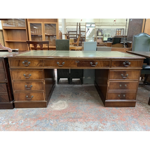 228 - A 19th century style mahogany and green leather pedestal writing desk - approx. 77cm high x 183cm wi... 