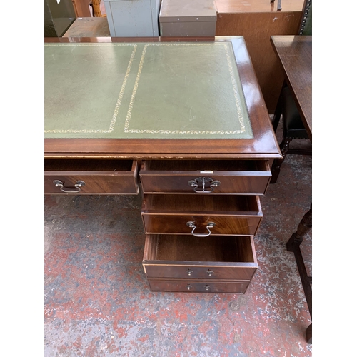 228 - A 19th century style mahogany and green leather pedestal writing desk - approx. 77cm high x 183cm wi... 