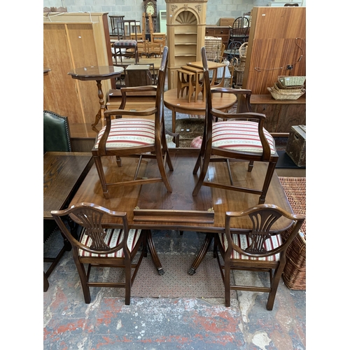 230 - A Georgian style mahogany twin pedestal extending ‘D’ end dining table and six shield back chairs - ... 