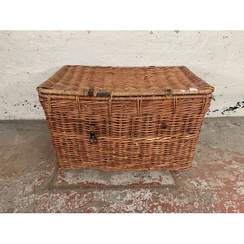 231 - A wicker basket - approx. 55cm high x 89cm wide x 55cm deep