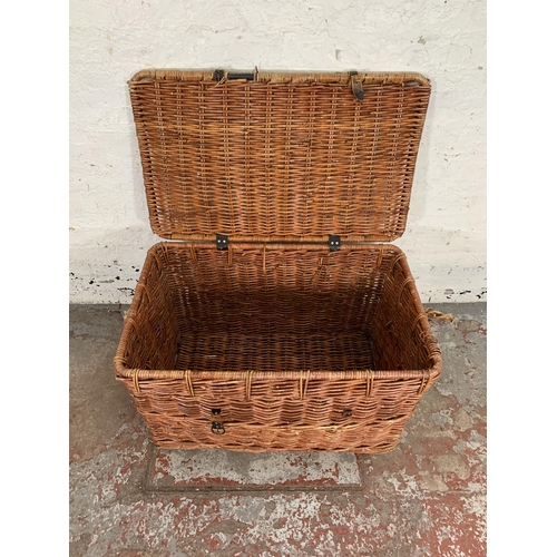 231 - A wicker basket - approx. 55cm high x 89cm wide x 55cm deep