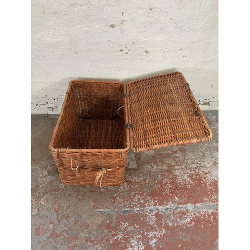 231 - A wicker basket - approx. 55cm high x 89cm wide x 55cm deep