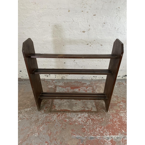 241 - A stained beech three tier shoe rack - approx. 106cm high x 107cm wide x 30cm deep