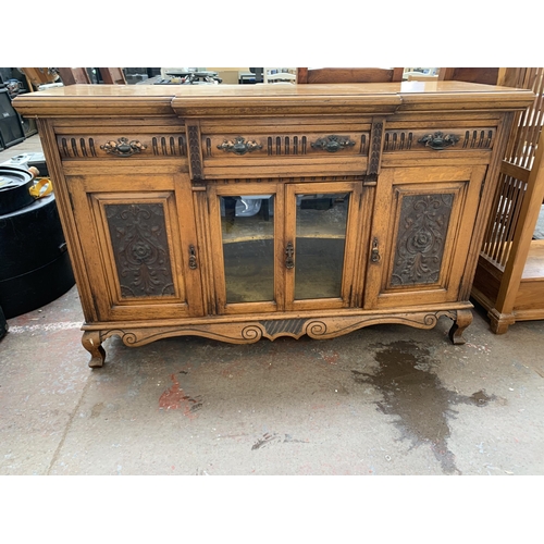 242 - A late 19th/early 20th century Rhind & Sons of Stretford Road Manchester carved oak sideboard - appr... 