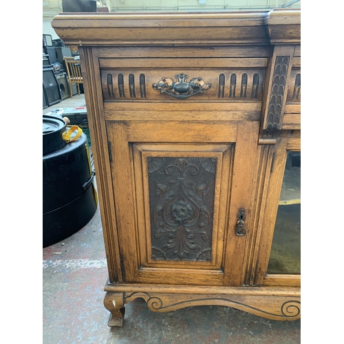 242 - A late 19th/early 20th century Rhind & Sons of Stretford Road Manchester carved oak sideboard - appr... 