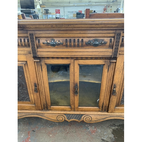 242 - A late 19th/early 20th century Rhind & Sons of Stretford Road Manchester carved oak sideboard - appr... 