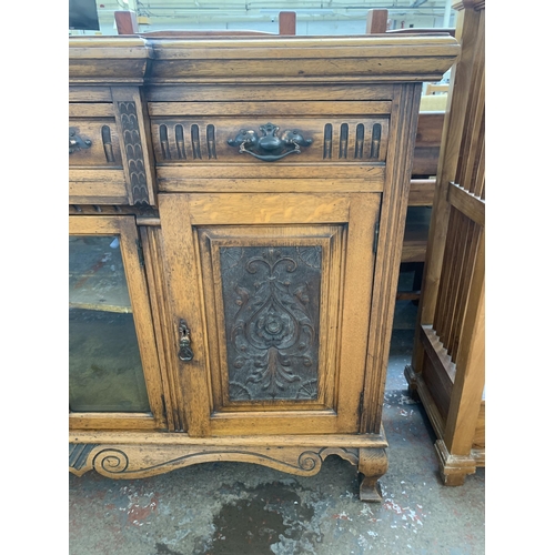 242 - A late 19th/early 20th century Rhind & Sons of Stretford Road Manchester carved oak sideboard - appr... 