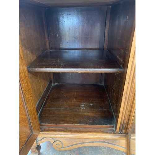 242 - A late 19th/early 20th century Rhind & Sons of Stretford Road Manchester carved oak sideboard - appr... 