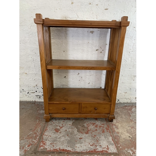 243 - A modern teak two tier bookcase with two lower drawers - approx. 113cm high x 83cm wide x 39cm deep