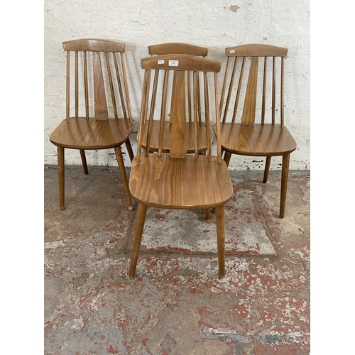 244 - Four Ercol style beech dining chairs