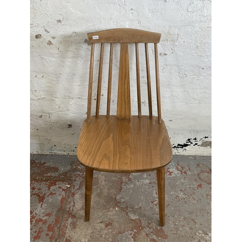 244 - Four Ercol style beech dining chairs