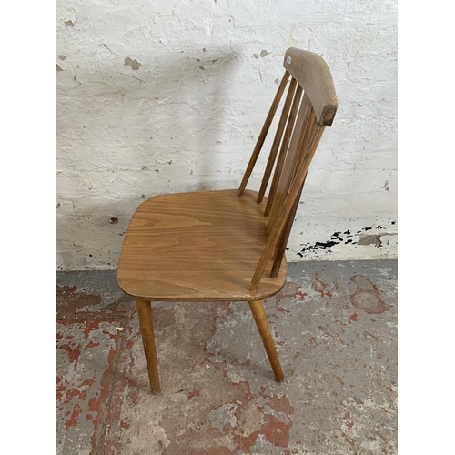 244 - Four Ercol style beech dining chairs