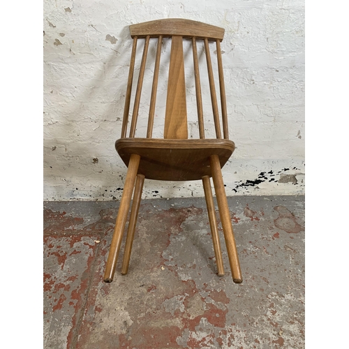 244 - Four Ercol style beech dining chairs