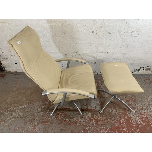 246 - A modern cream leather and grey metal swivel reclining armchair and footstool