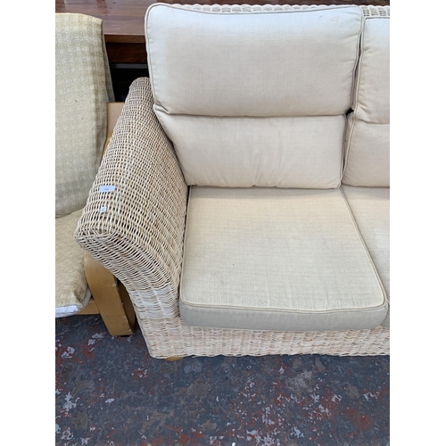 248 - A modern wicker and fabric upholstered two seater sofa